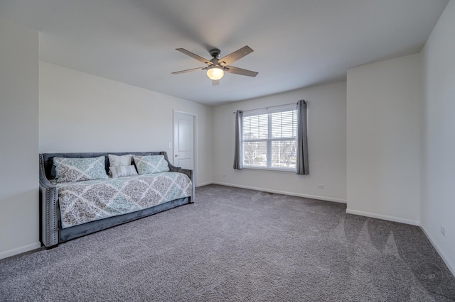 bedroom with baseboards, carpet, and a ceiling fan