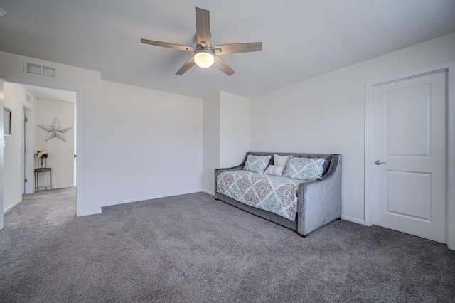 unfurnished bedroom featuring visible vents, carpet, and ceiling fan