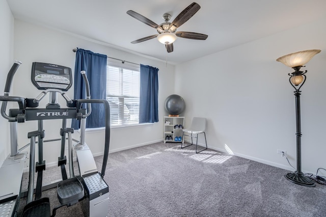 workout room featuring carpet flooring, baseboards, and a ceiling fan