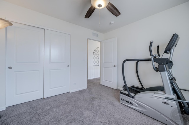 workout room with visible vents, baseboards, carpet, and ceiling fan