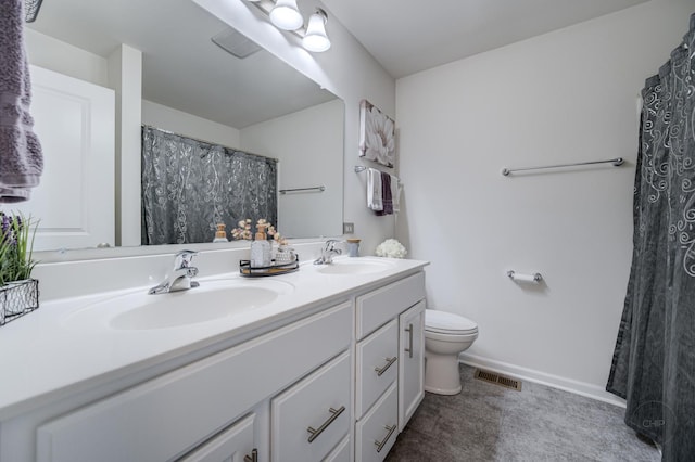 full bath with double vanity, toilet, visible vents, and a sink