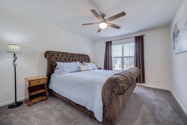 carpeted bedroom featuring baseboards and ceiling fan