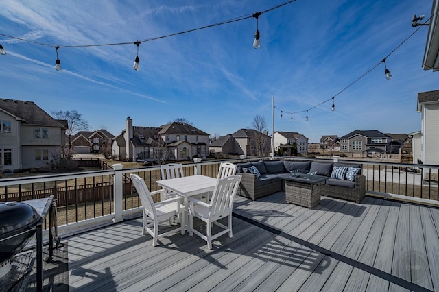 wooden terrace with a residential view, an outdoor hangout area, outdoor dining space, and area for grilling