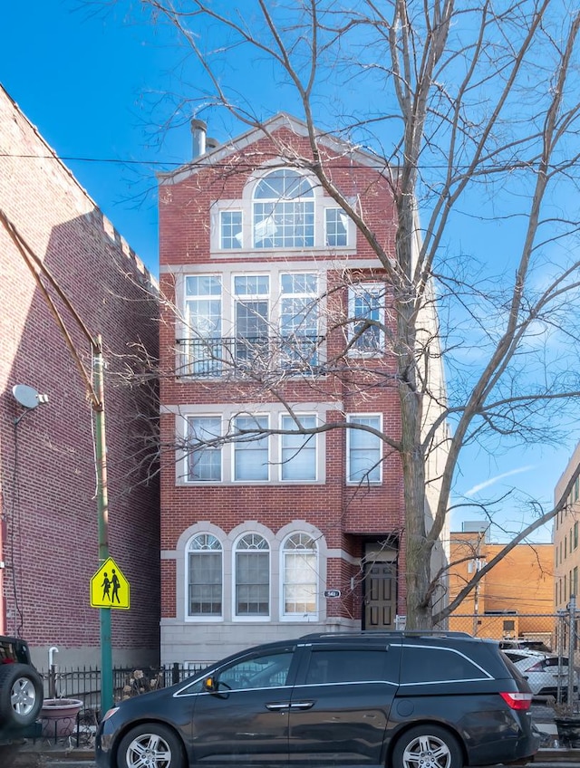 view of front of property featuring brick siding