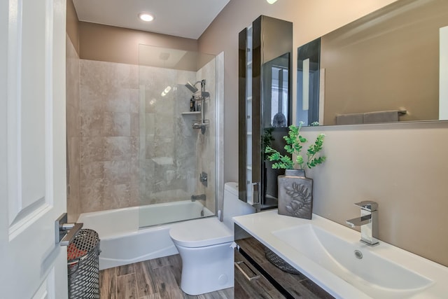 full bathroom featuring vanity, shower / tub combination, toilet, and wood finished floors