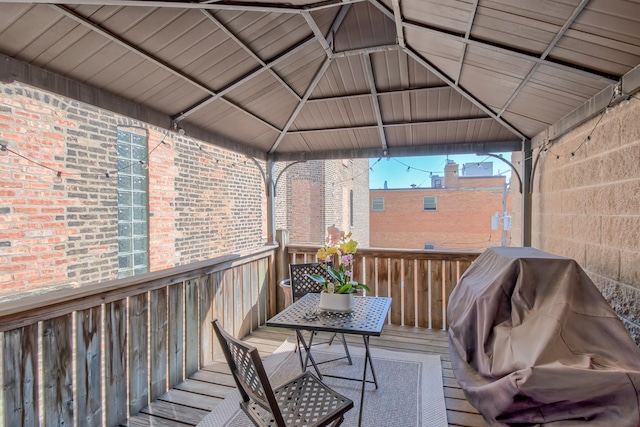 deck featuring a gazebo and grilling area