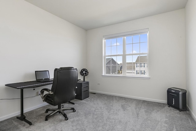 office space with baseboards and carpet floors