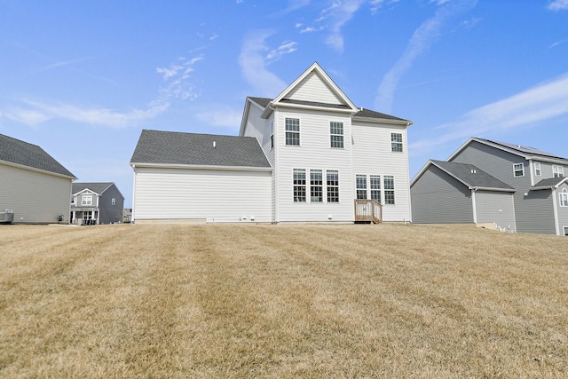 back of property with a yard and cooling unit