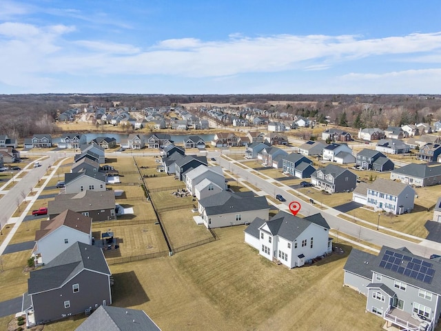 birds eye view of property with a residential view