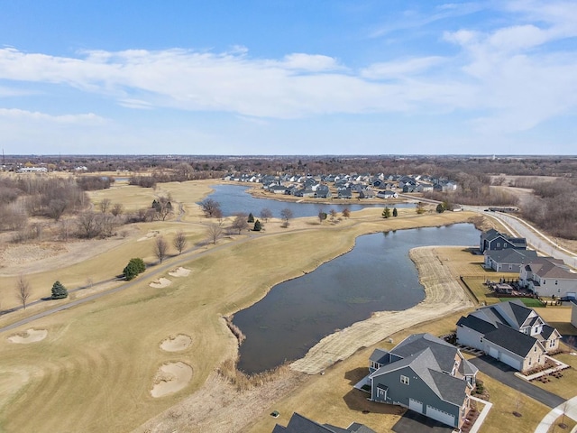 drone / aerial view featuring a residential view and a water view