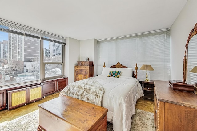 bedroom with multiple windows