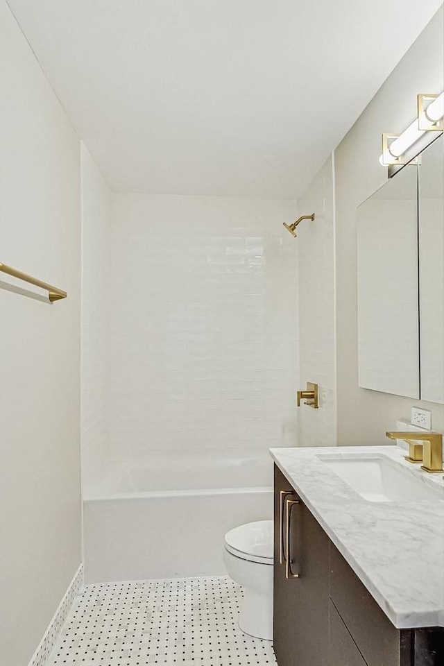 bathroom featuring toilet, bathtub / shower combination, and vanity