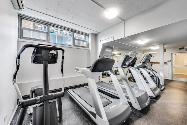 gym featuring visible vents and baseboards