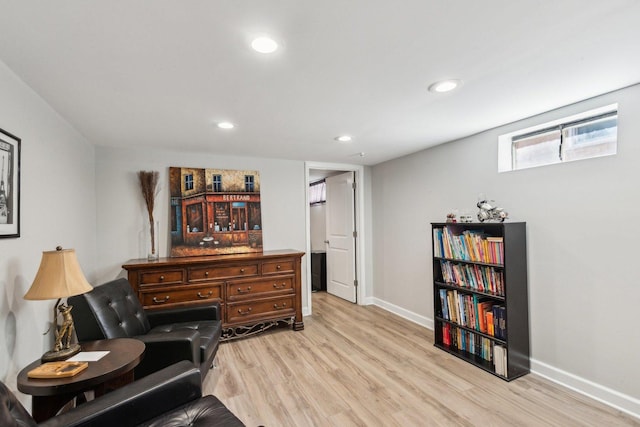 sitting room with recessed lighting, baseboards, and light wood finished floors