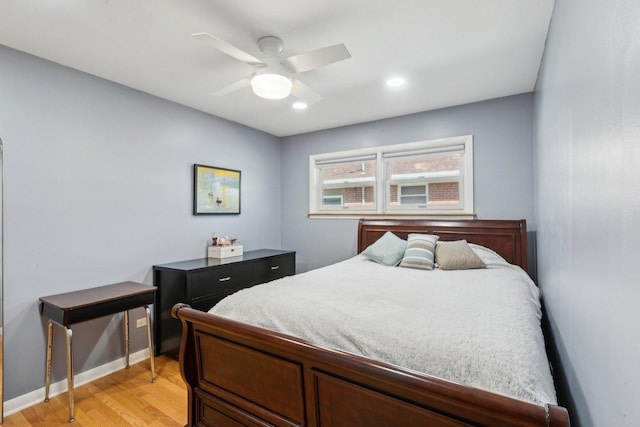 bedroom featuring a ceiling fan, recessed lighting, baseboards, and light wood-type flooring