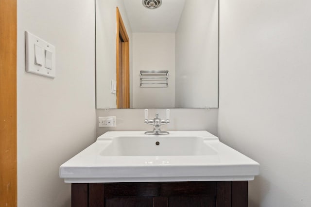 bathroom with visible vents and a sink