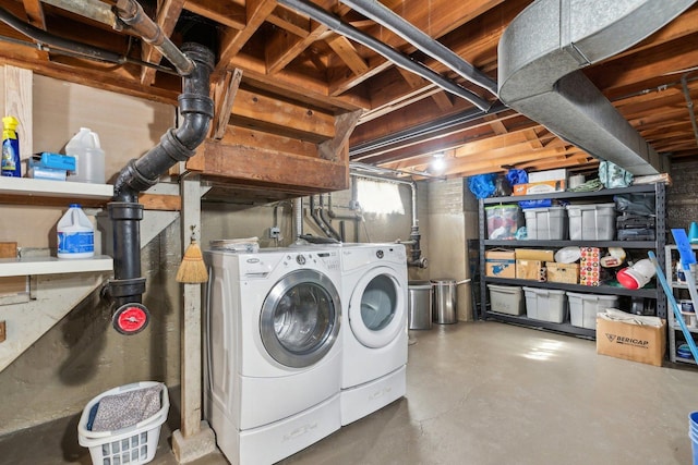 laundry room featuring laundry area and washing machine and clothes dryer