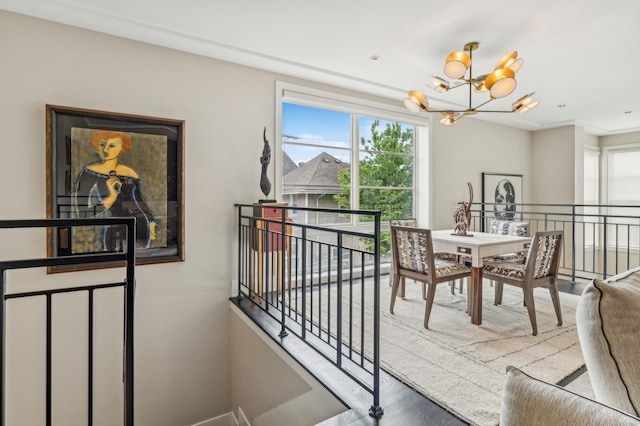 dining space with a notable chandelier and a healthy amount of sunlight