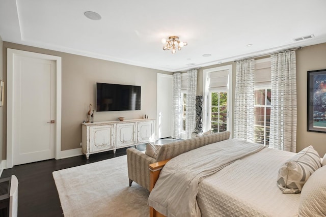 bedroom featuring dark wood-type flooring, baseboards, and visible vents