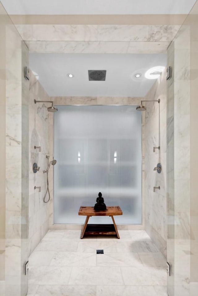 bathroom featuring visible vents and a shower stall