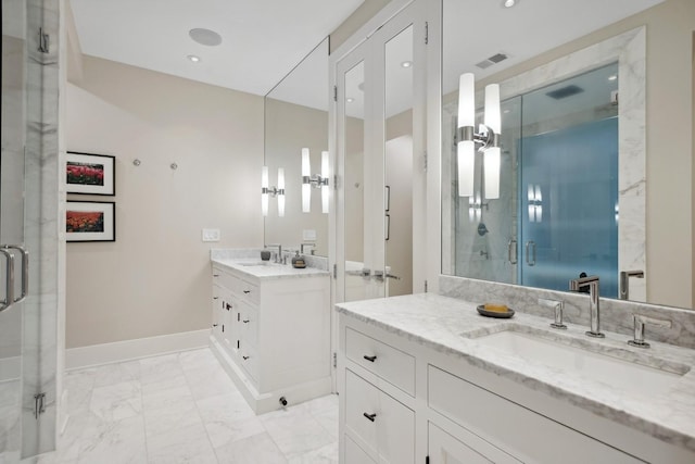 bathroom with baseboards, two vanities, a sink, a shower stall, and marble finish floor