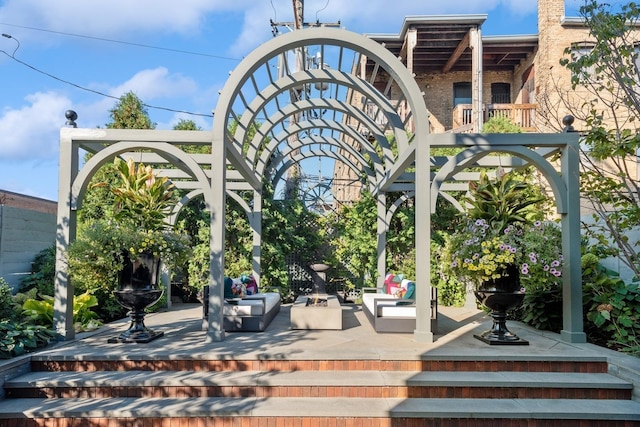 view of community featuring a patio area and an outdoor living space