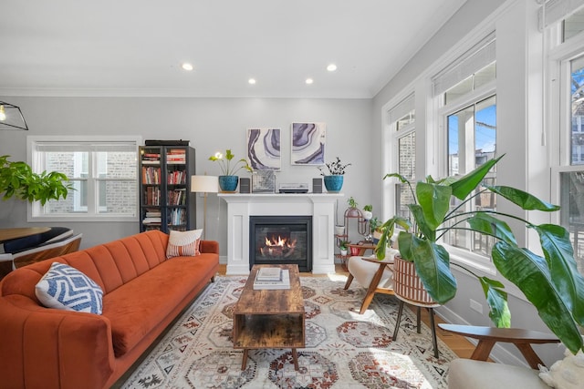 living area with plenty of natural light, recessed lighting, and a glass covered fireplace