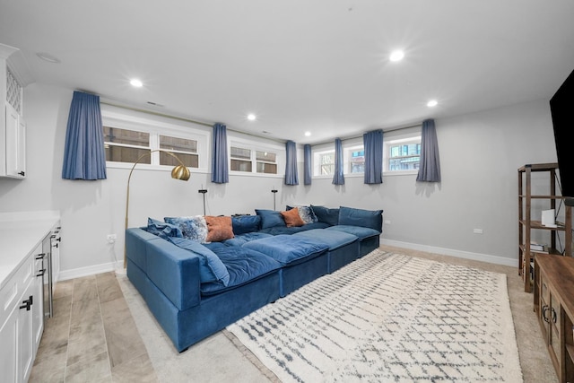 living area with recessed lighting and baseboards