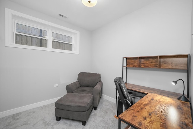 office with visible vents, light colored carpet, and baseboards