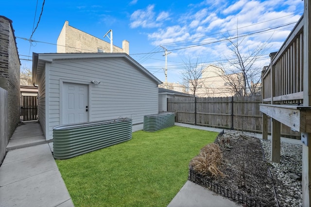 view of yard with an outdoor structure and fence