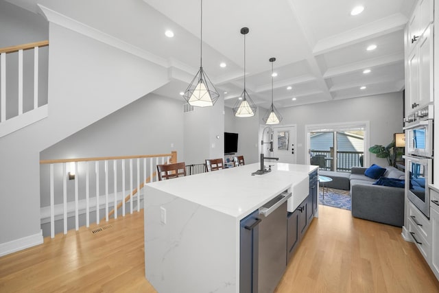 kitchen featuring white cabinetry, light wood-style flooring, recessed lighting, and appliances with stainless steel finishes