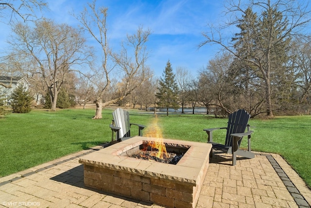 view of patio / terrace with an outdoor fire pit