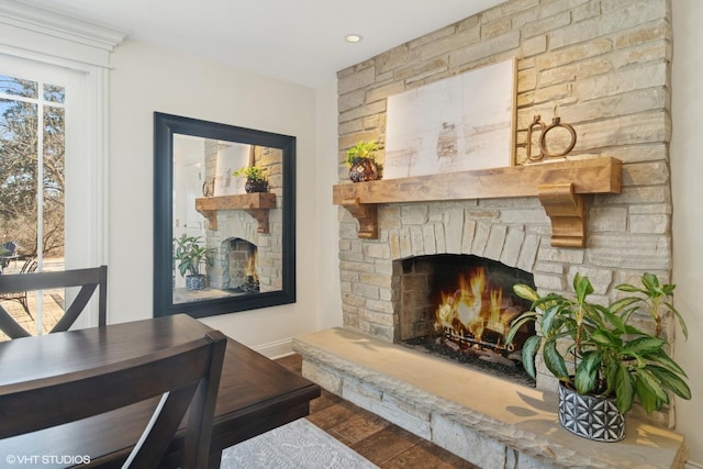 living area featuring wood finished floors and a fireplace