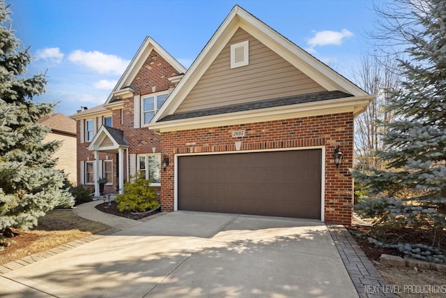 traditional home with concrete driveway and brick siding