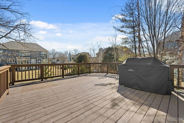 wooden terrace with a grill