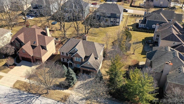 birds eye view of property with a residential view