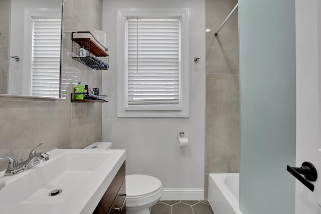 full bathroom with tile patterned floors, toilet, vanity, and baseboards