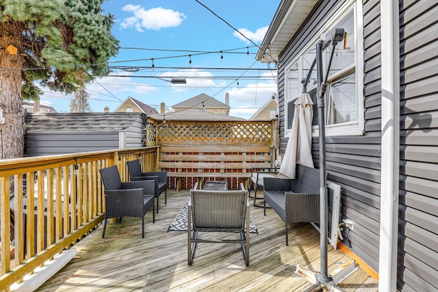 wooden deck featuring an outdoor hangout area