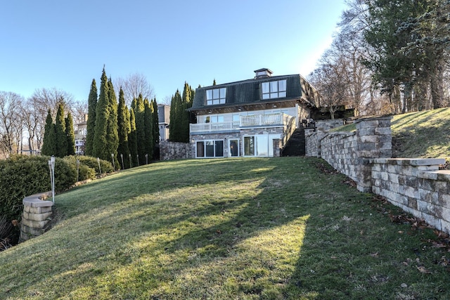 view of yard featuring a deck and stairs