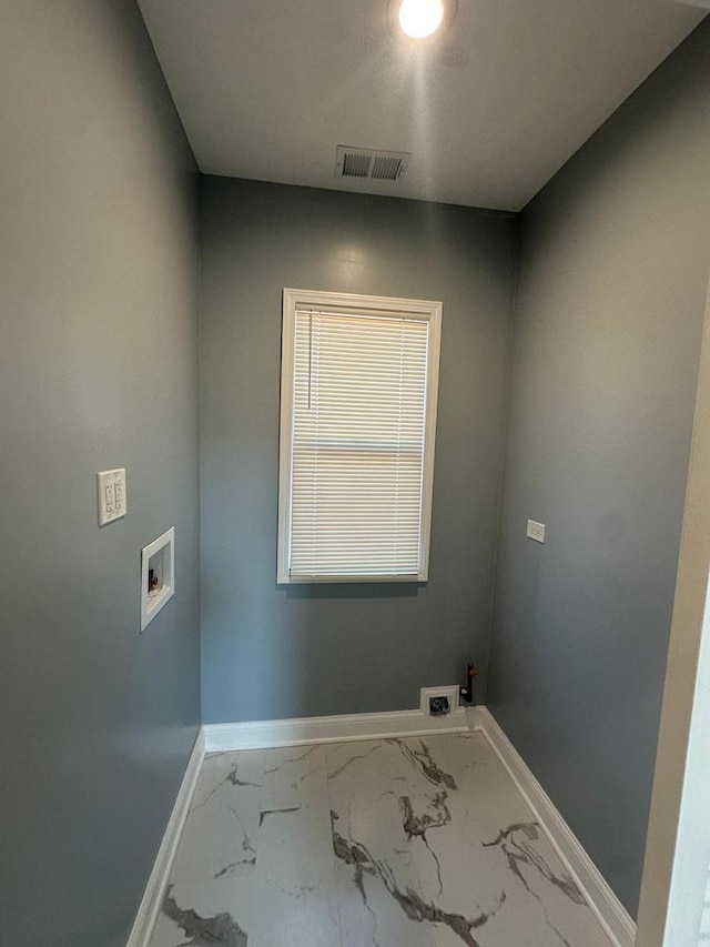 washroom with hookup for a washing machine, visible vents, baseboards, laundry area, and marble finish floor