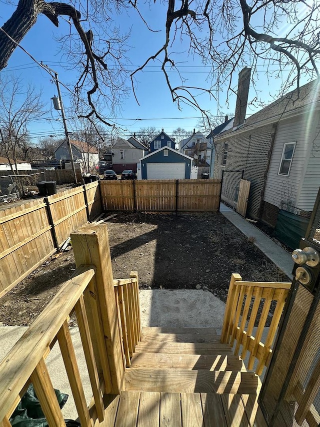 view of yard featuring a fenced backyard and a residential view