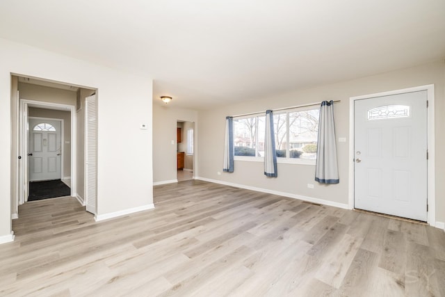 entrance foyer featuring light wood-style floors and baseboards