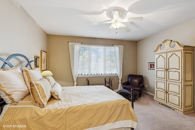 bedroom with light carpet, baseboards, and a ceiling fan