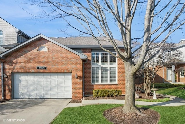 traditional home with a garage, brick siding, roof with shingles, and driveway