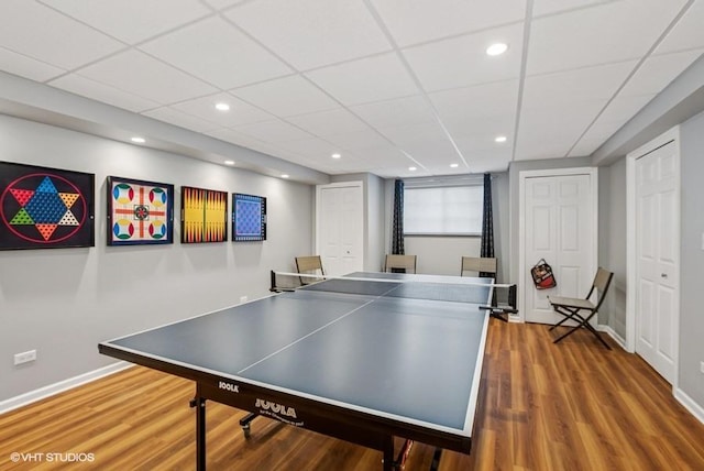 game room featuring recessed lighting, wood finished floors, and baseboards