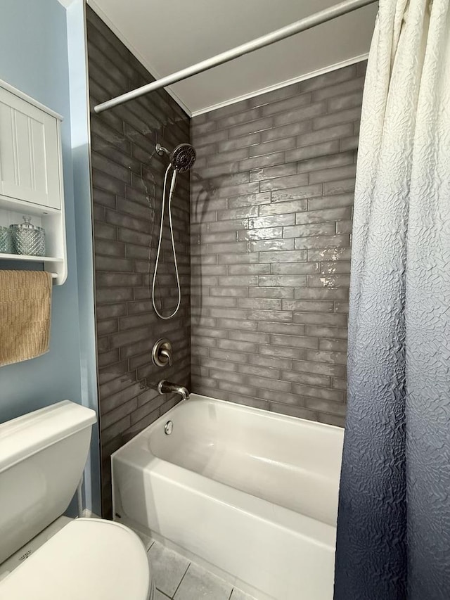 full bathroom with shower / bath combo with shower curtain, toilet, and tile patterned flooring