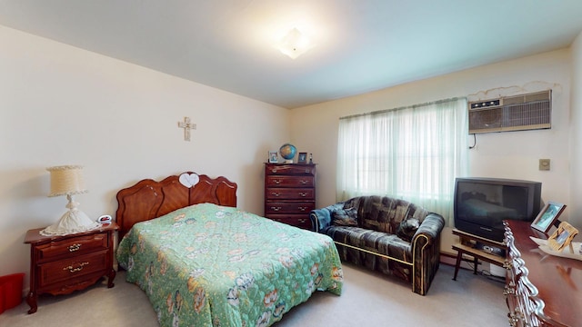 carpeted bedroom with a wall mounted AC