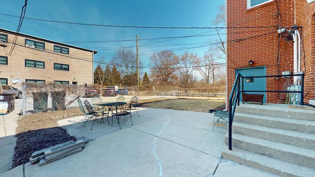 view of patio / terrace with outdoor dining space and fence