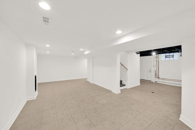 below grade area featuring stairway, recessed lighting, and baseboards