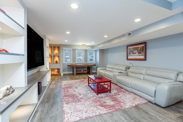 living area featuring recessed lighting, wood finished floors, visible vents, and baseboards